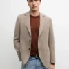 Blazer en lin à la coupe ajustée avec détails de poches Blazer en lin à la coupe ajustée avec détails de poches