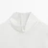 Blouse à col montant avec détail à l’ourlet Blouse à col montant avec détail à l’ourlet
