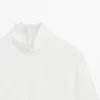 Blouse à col montant avec détail à l’ourlet Blouse à col montant avec détail à l’ourlet