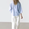 Blouse fluide avec col boutonné Blouse fluide avec col boutonné
