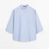 Blouse fluide avec col boutonné Blouse fluide avec col boutonné
