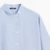 Blouse fluide avec col boutonné Blouse fluide avec col boutonné