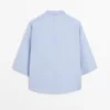 Blouse fluide avec col boutonné Blouse fluide avec col boutonné