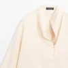 Blouse fluide avec détail plastron Blouse fluide avec détail plastron