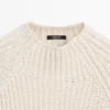 Cape en tricot avec fentes Cape en tricot avec fentes