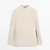 Cape en tricot avec fentes Cape en tricot avec fentes