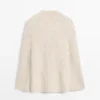 Cape en tricot avec fentes Cape en tricot avec fentes