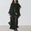 Cape en tricot mélangé laine avec franges Cape en tricot mélangé laine avec franges