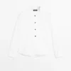 Chemise à col montant avec boutons dorés Chemise à col montant avec boutons dorés
