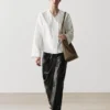 Chemise fluide avec détail sur la poitrine Chemise fluide avec détail sur la poitrine