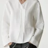 Chemise fluide avec détail sur la poitrine Chemise fluide avec détail sur la poitrine