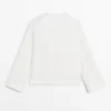 Chemise fluide avec détail sur la poitrine Chemise fluide avec détail sur la poitrine