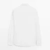 Chemise slim fit en popeline 100 % coton Chemise slim fit en popeline 100 % coton