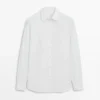 Chemise slim fit en popeline 100 % coton Chemise slim fit en popeline 100 % coton