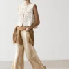 Gilets en coton au crochet avec détails floraux Gilets en coton au crochet avec détails floraux