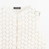 Gilets en coton au crochet avec détails floraux Gilets en coton au crochet avec détails floraux