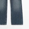 Jean taille moyenne, coupe raccourcie et évasée Jean taille moyenne, coupe raccourcie et évasée