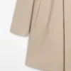 Manteau en coton à carreaux avec détails intérieurs Manteau en coton à carreaux avec détails intérieurs