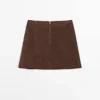 Mini-jupe en cuir suédé Mini-jupe en cuir suédé