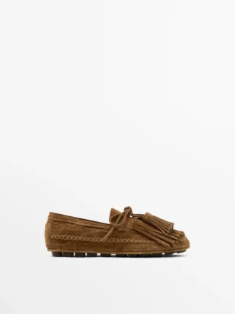 Mocassins en daim refendu avec franges et pompons