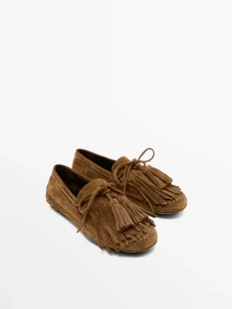 Mocassins en daim refendu avec franges et pompons