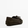 Mocassins en daim refendu avec franges et pompons Mocassins en daim refendu avec franges et pompons