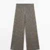 Pantalon à jambes larges avec détails rayés