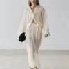 Pantalon sarouel fluide avec détails plissés Pantalon sarouel fluide avec détails plissés