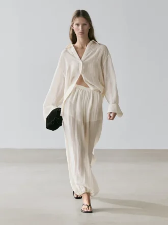 Pantalon sarouel fluide avec détails plissés