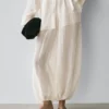 Pantalon sarouel fluide avec détails plissés Pantalon sarouel fluide avec détails plissés