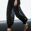 Pantalon sarouel semi-transparent avec boutons Pantalon sarouel semi-transparent avec boutons