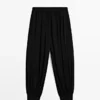 Pantalon sarouel semi-transparent avec boutons Pantalon sarouel semi-transparent avec boutons