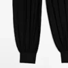 Pantalon sarouel semi-transparent avec boutons Pantalon sarouel semi-transparent avec boutons
