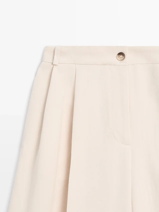 Pantalons fluides avec ourlets retroussés Pantalons fluides avec ourlets retroussés
