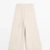 Pantalons fluides avec ourlets retroussés Pantalons fluides avec ourlets retroussés