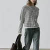 Pull en maille rayée avec détail sur les manches Pull en maille rayée avec détail sur les manches